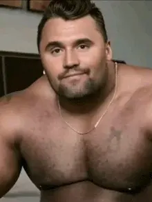 A man with a big chest and no shirt.
