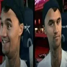 A man in a white shirt and black hat.
