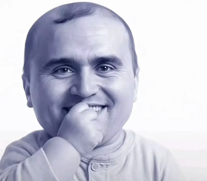 A man with a tooth in his mouth.