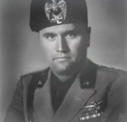 A black and white photo of a man in uniform.