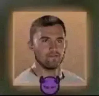 A man with a purple tie and a white shirt.