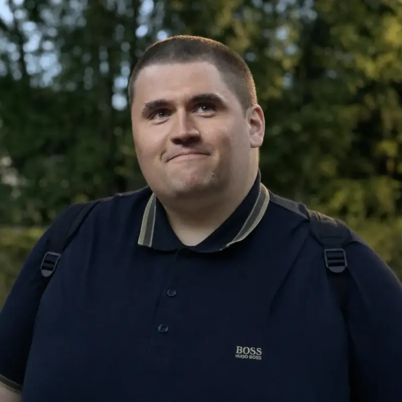 A man with a black shirt and a black shirt.