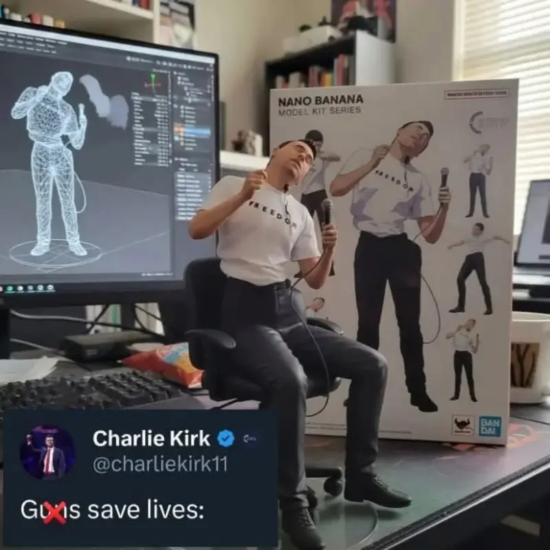 A man sitting on a desk with a computer.