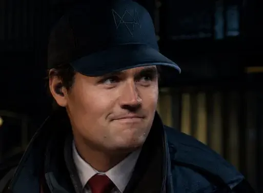 A man in a hat and jacket looking at the camera.