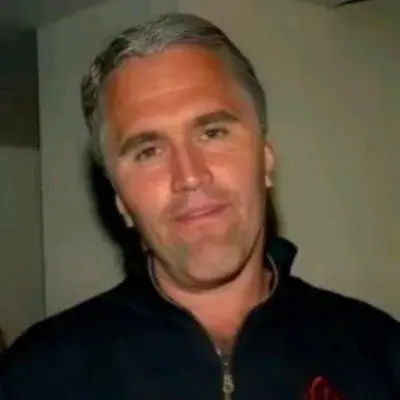 A man in a black shirt and a red shirt.