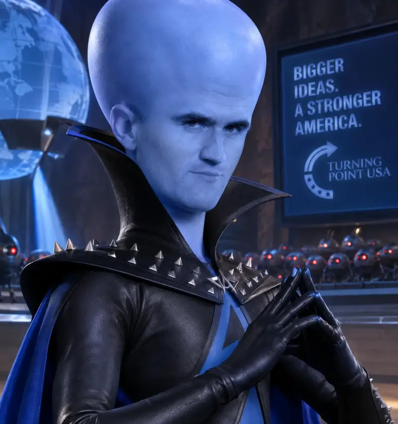 A man in a blue cape and black gloves.