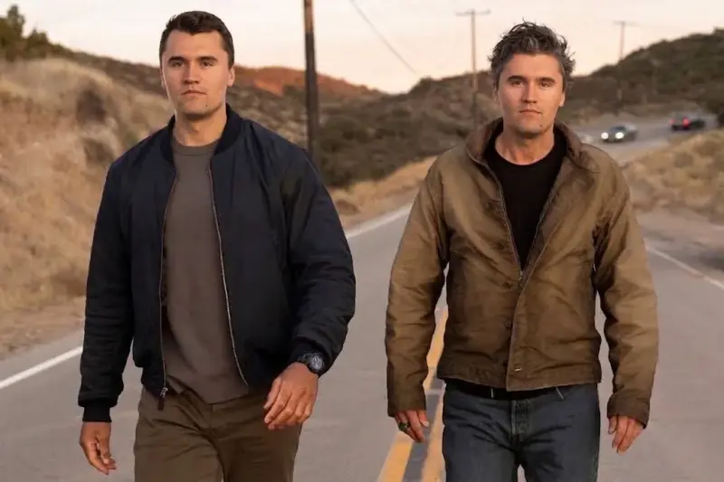 Two men walking down the road.