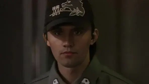 A man in a uniform and a hat.