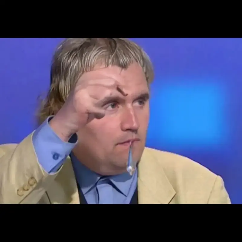 A man with a surprised look on his face.
