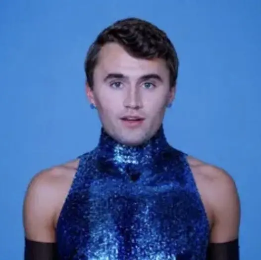 A man in a blue shirt and black shirt.