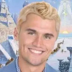A man with blonde hair and a blue shirt.