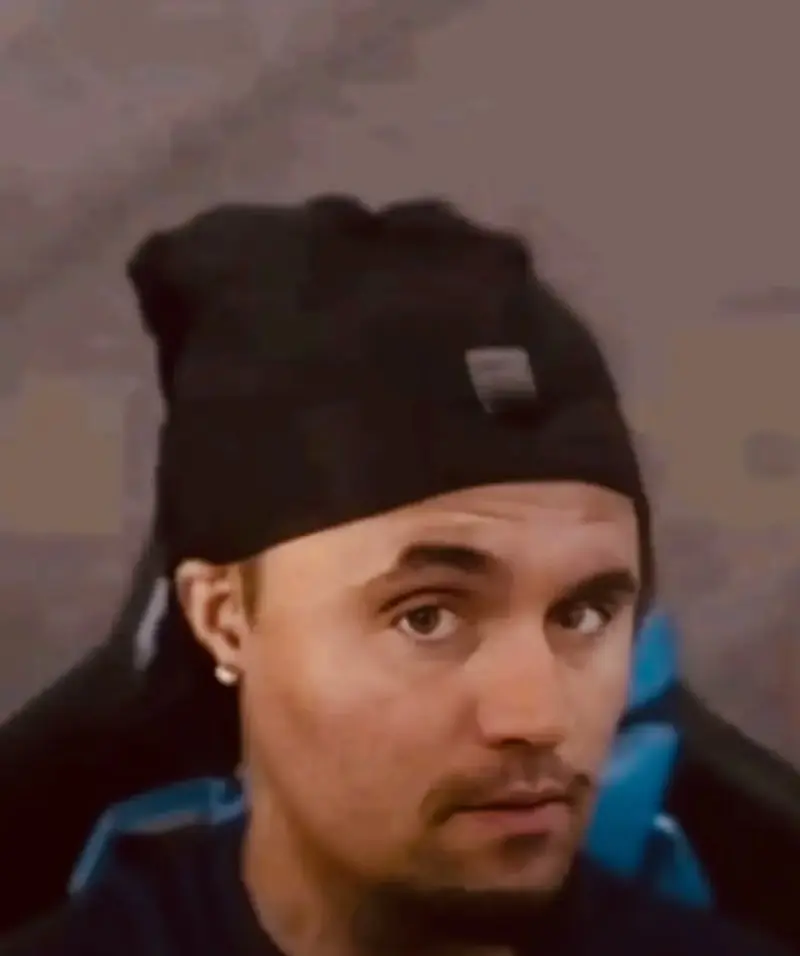 A man wearing a black hat.