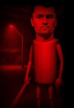 A red light shining on a doll.