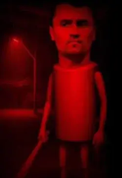 A red light shining on a man ' s face.